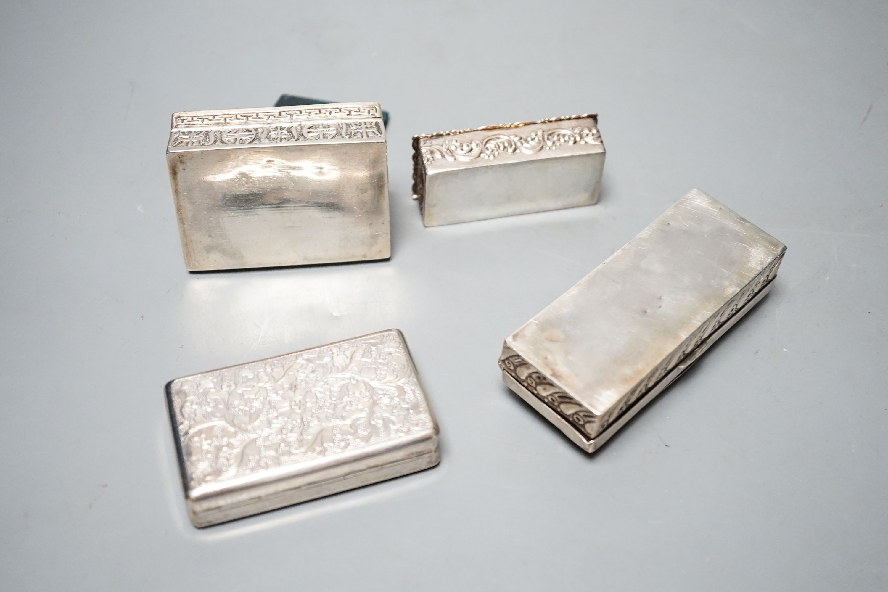 A late Victorian silver ring box, London, 1895(a.f.), 97mm, a later silver snuff box and two white metakl boxes.